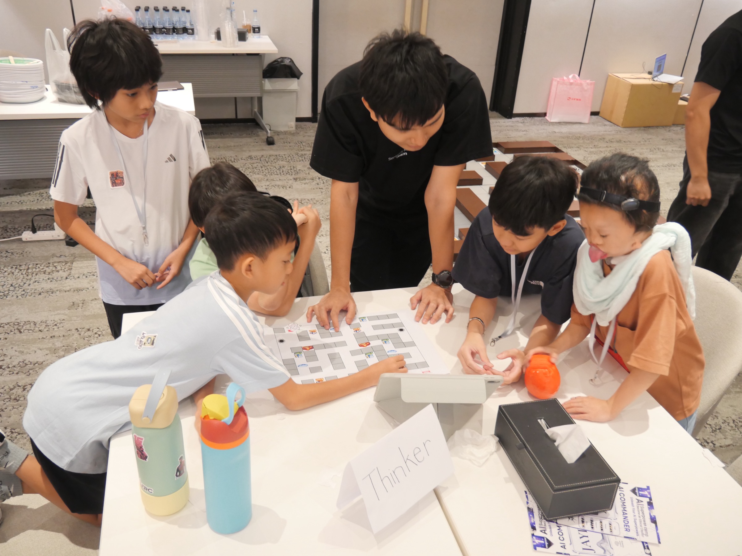 Children collaborating on a thinking exercise — 'Thinker' board at Sentient Minds Camp